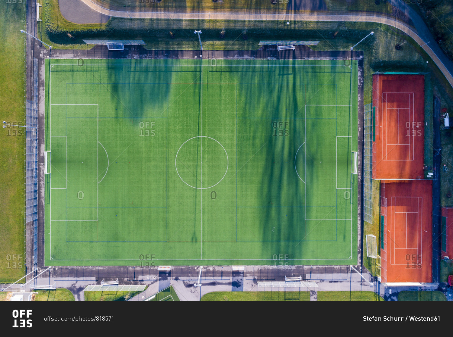 Empty football ground and tennis courts- top view