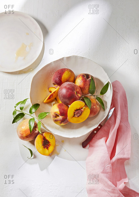 Bowl of ripe yellow peaches