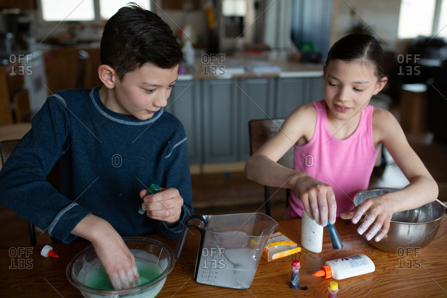 Kids making homemade slime together at home