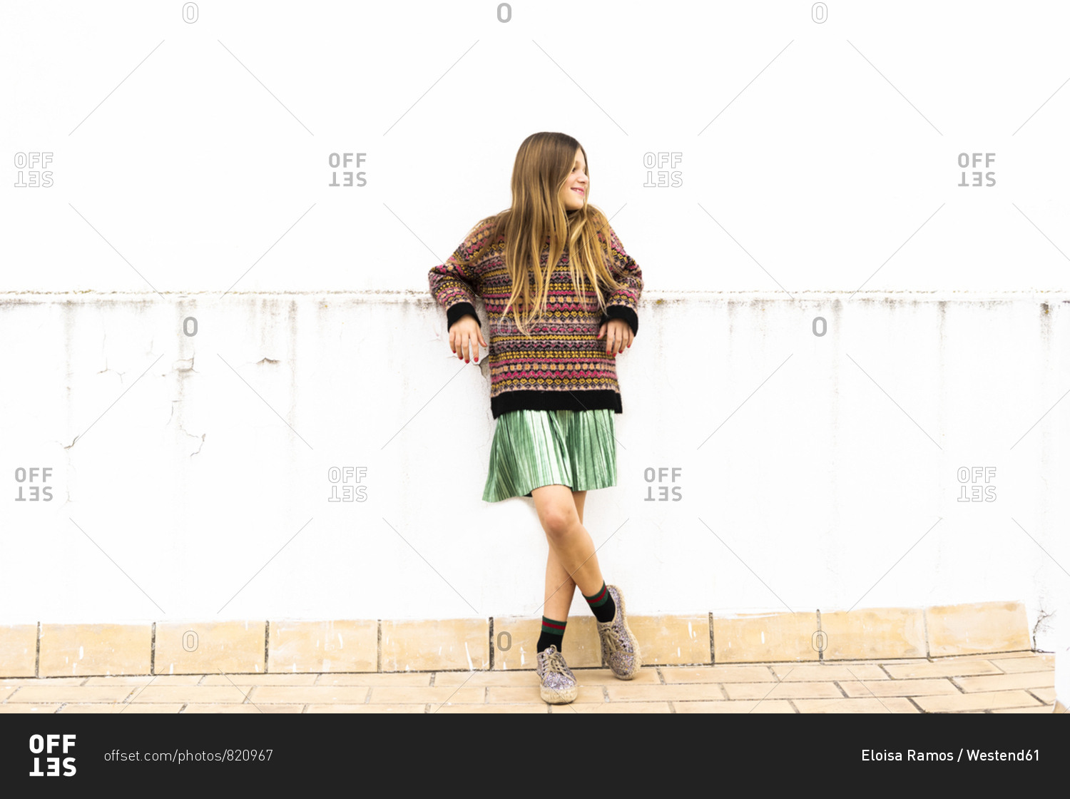 Relaxed girl standing on roof terrace
