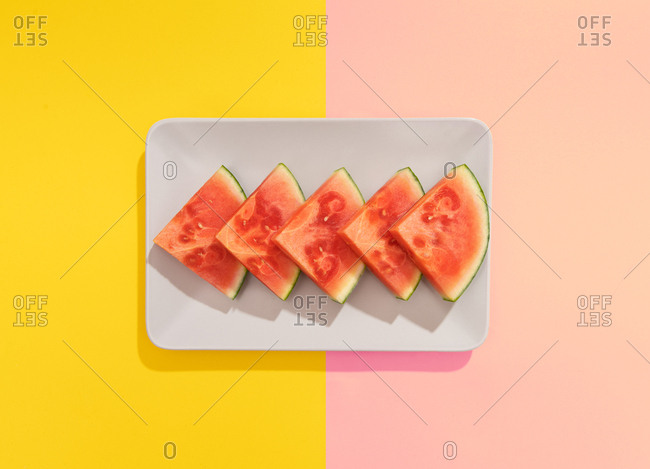 Summer juicy fruit watermelon in colorful background from above