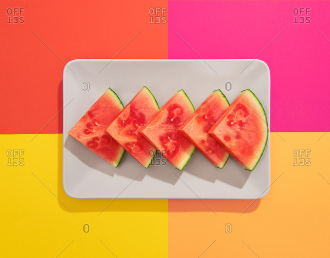 Summer juicy fruit watermelon in colorful background from above