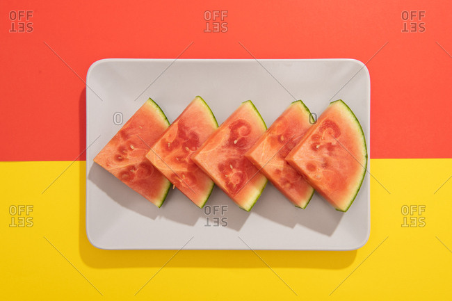 Summer juicy fruit watermelon in colorful background from above