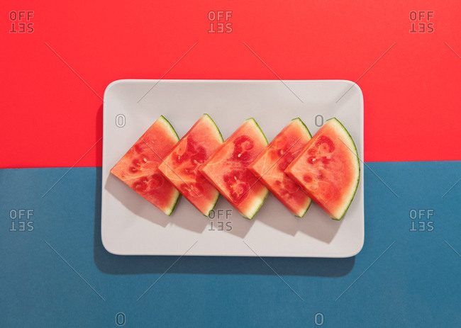 Summer juicy fruit watermelon on colorful background from above
