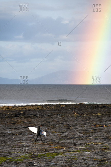 Surfer exploring the coast of Ireland on a surf trip