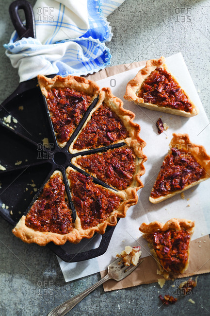 High angle view of coconut pecan pie served on table at home