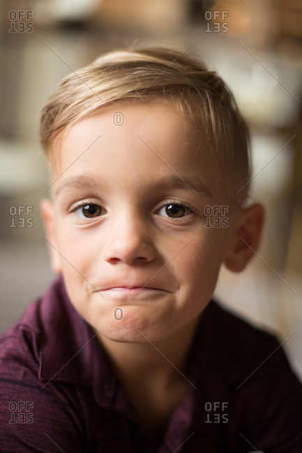 Big, brown eyed boy has a determined, sweet expression and face