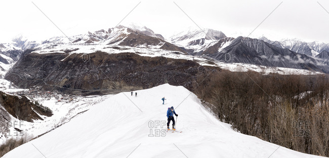Georgia- Caucasus- Gudauri- people on a ski tour to Lomisi Monastery