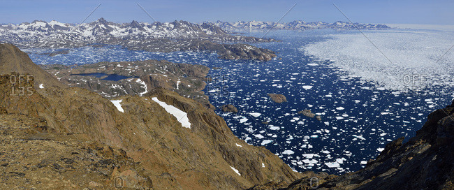 Greenland, East Greenland, Aerial view of Ammassalik island and fjord with  pack or drift ice stock photo