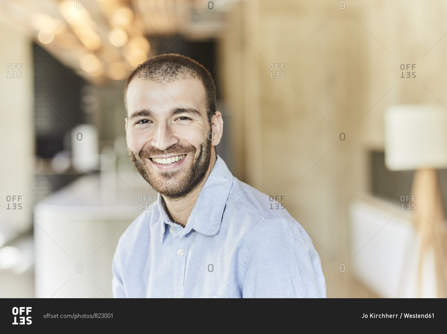 Portrait of happy businessman in modern office