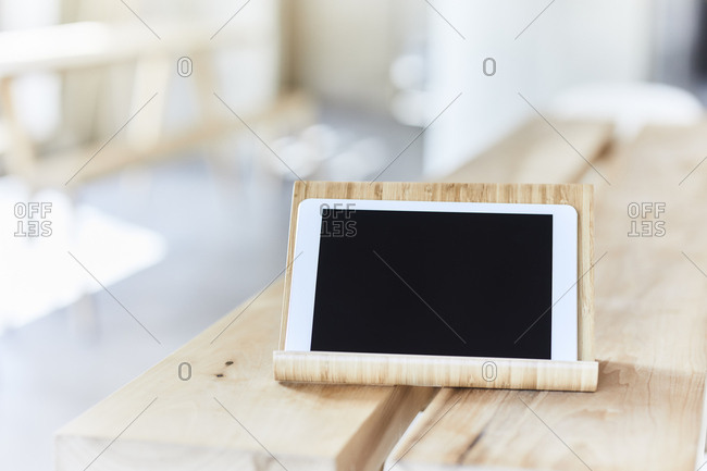 Tablet on wooden bench