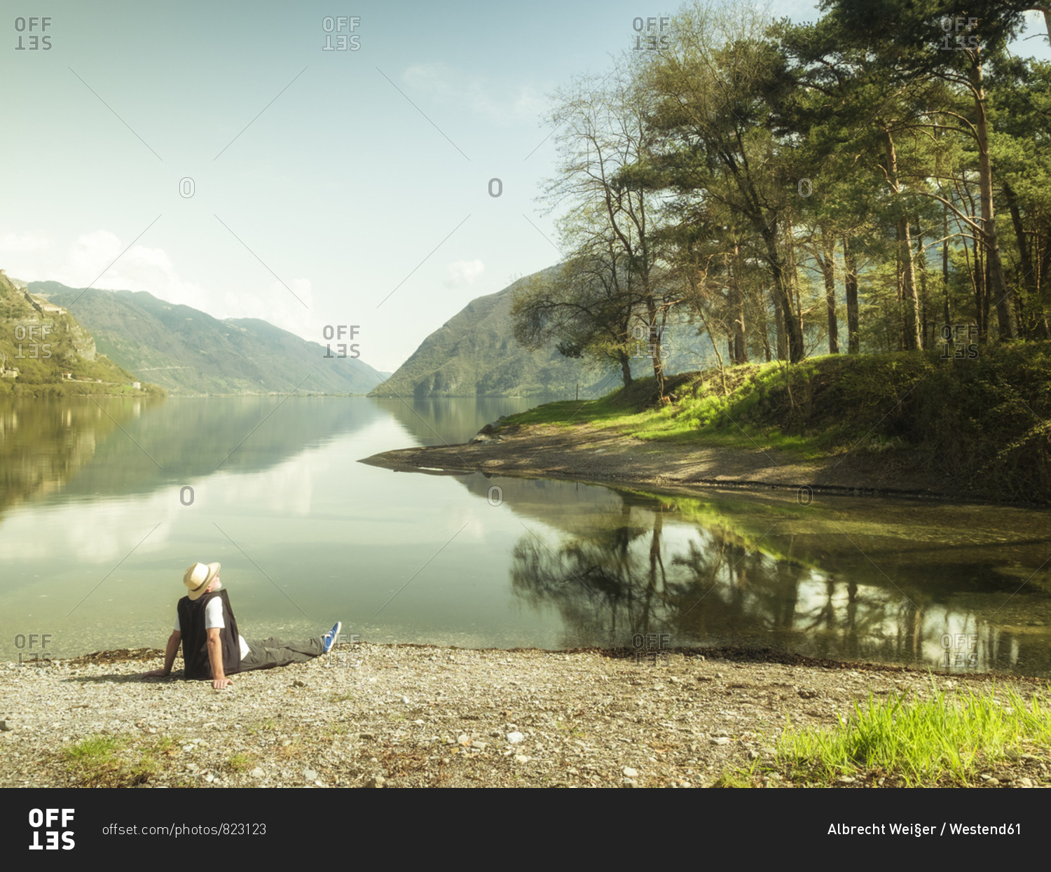 Italy- Lombardy- senior man having a break at Lake Idro