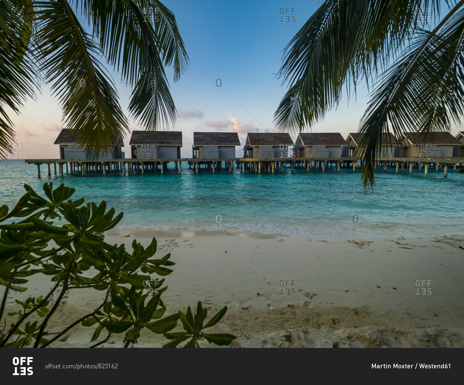 Maledives- Ross Atoll- water bungalows at the beach in the evening