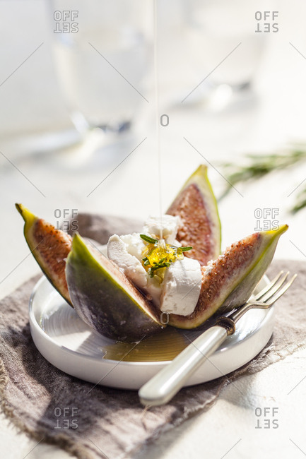 Figs and goat cheese- rosemary- pouring with honey
