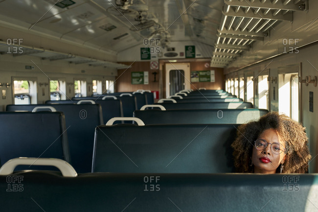 Portrait of young woman in a train