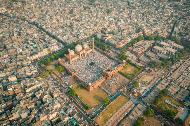 DELHI, INDIA - 5 JUNE 2019: Aerial view of devotees at prayer during Eid al-Fitr at Jama Masjid mosque.