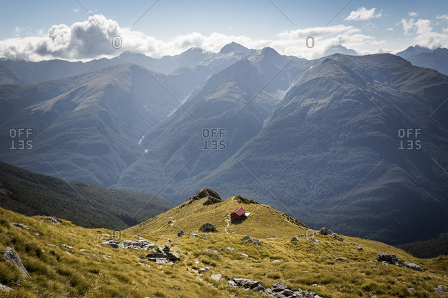 Remote wilderness hut in mountain scene in New Zealand
