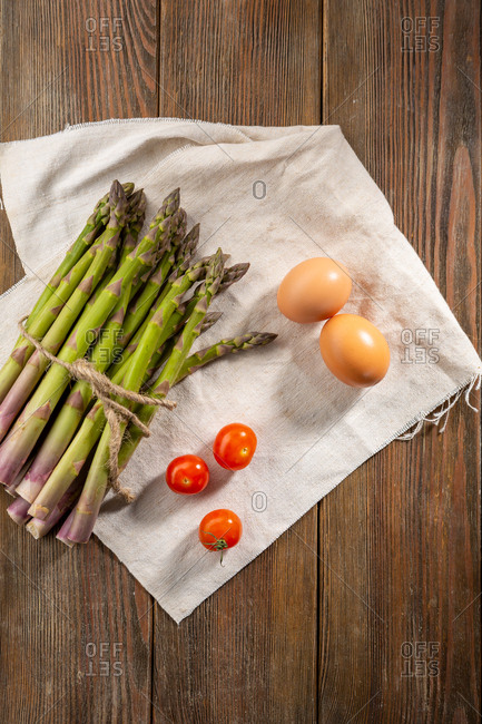 Fresh asparagus on wooden background