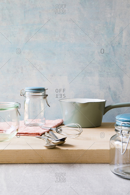 Glass storage jars and saucepan and whisk