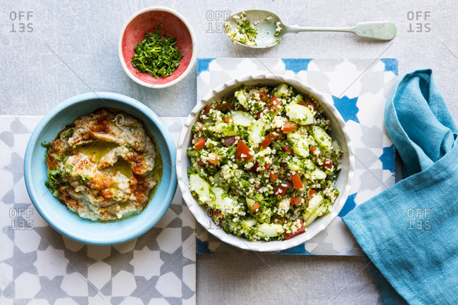 Lebanese food in bowls set on tiles