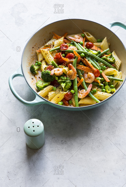 Pasta penne primavera and vegetables in skillet