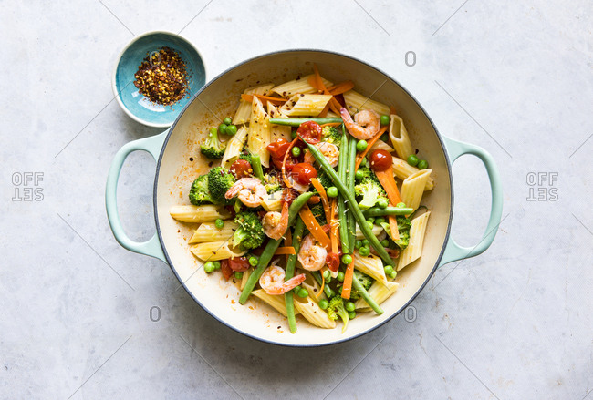 Pasta penne primavera and vegetables in skillet