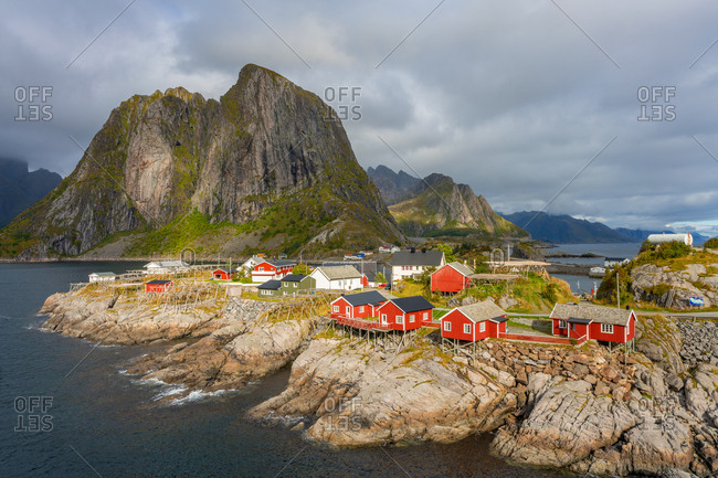 Red wooden huts, known as Rorbu, in the village of Reine on the Hamnoy island, Lofoten Islands, Norway. Rorbu is a Norwegian traditional house used by fishermen, today most are used by tourists.