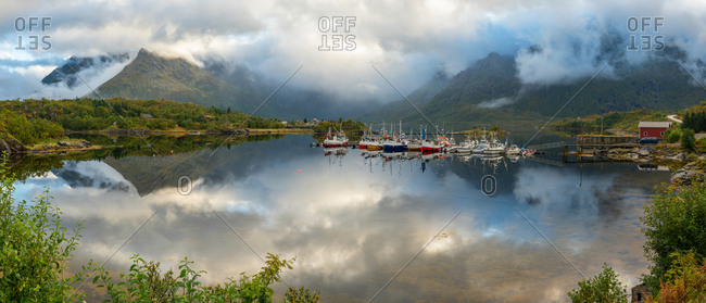 September 10, 2016: Fishing boats and traditional wooden huts, Lofoten islands, Norway