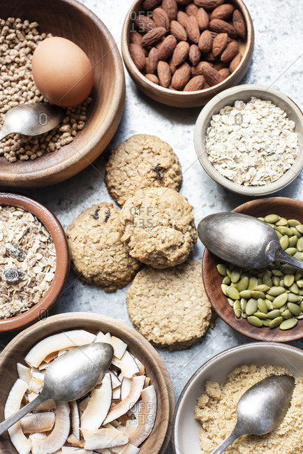 Ingredients for baking in bowls with cookies