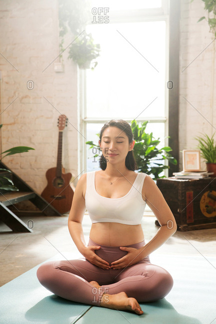 Pregnant women in indoor fitness