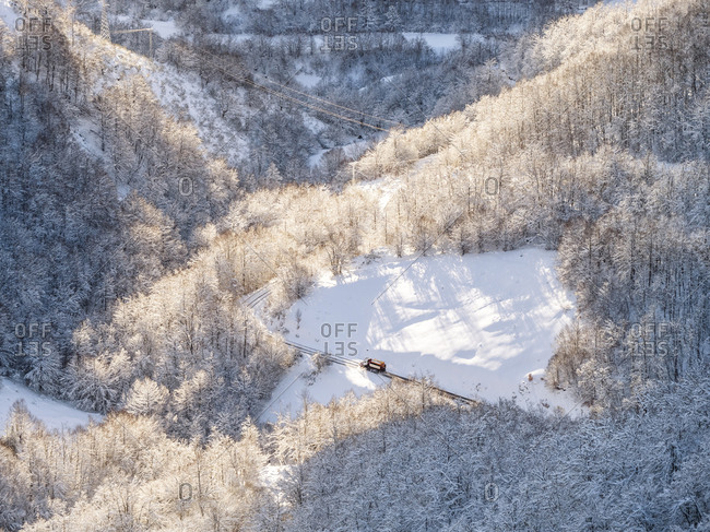 Spain- Asturia- Picos de Europa- Mirador De Piedrashistas- snow plow truck clearing road in winter