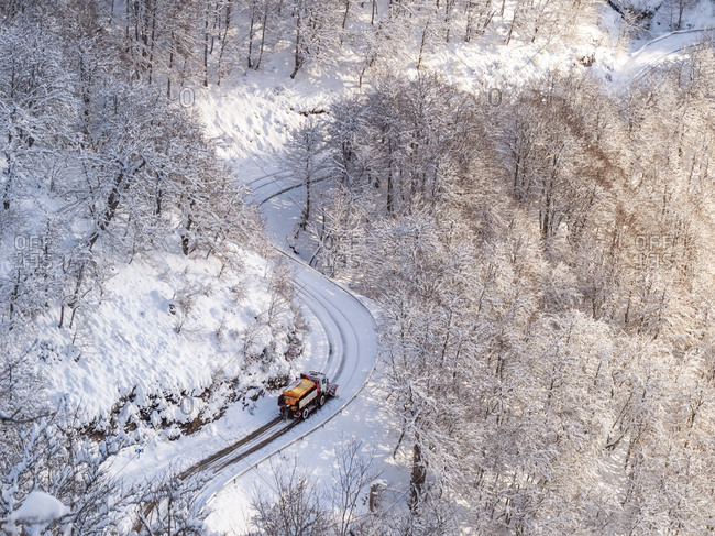 Spain- Asturia- Picos de Europa- Mirador De Piedrashistas- snow plow truck clearing road in winter