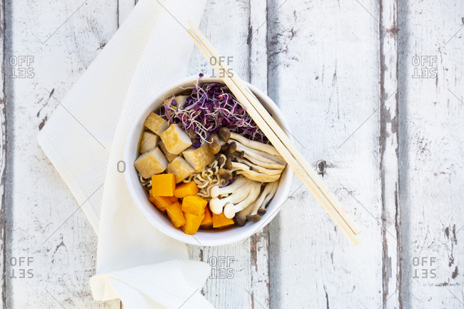 Miso Ramen soup with noodles- hokaido pumpkin- red radish sprouts- fried tofu- shimeji mushroom and king trumpet mushroom