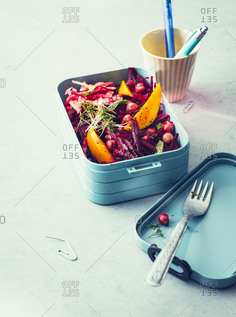 Beetroot salad with chickpeas and mango fruit in a lunch box