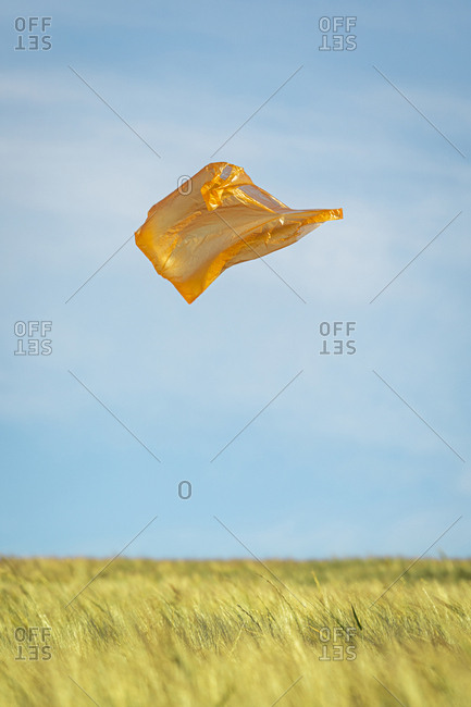 Orange plastic bag flying in the air