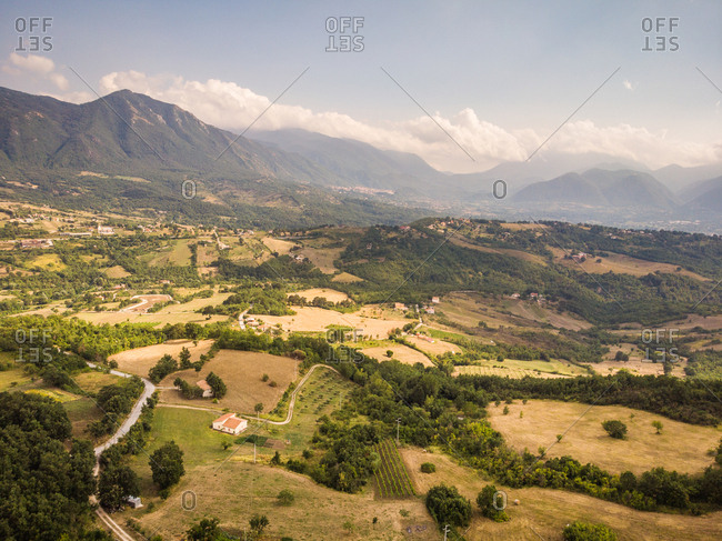Aerial view of rolling hills, mountains and country lanes in Avellino Province, Campania, Southern Italy.