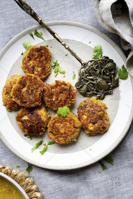 Sesame seed fritter, part of an Indian meal
