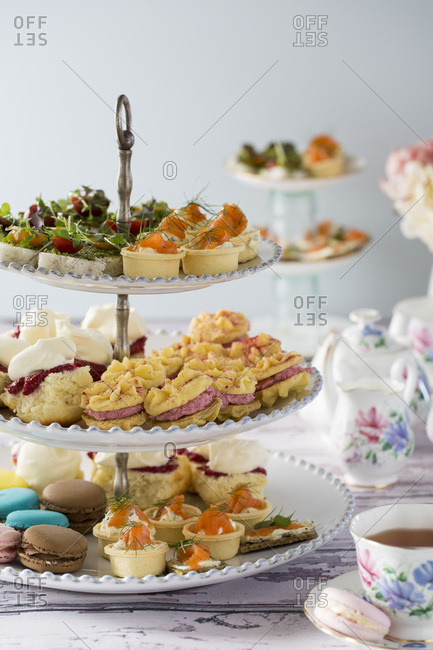 High Tea, or Afternoon Tea laid out on a table with traditional cups and saucers.