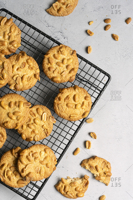 Crisp peanut cookies cooling on a wire rack.