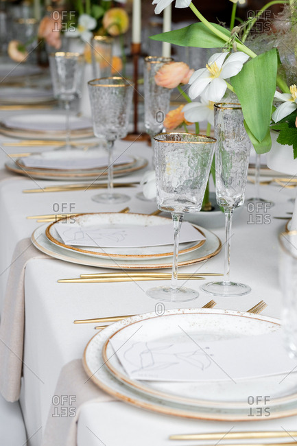 Set Table At A Wedding Reception With Gold Rimmed Glasses Stock