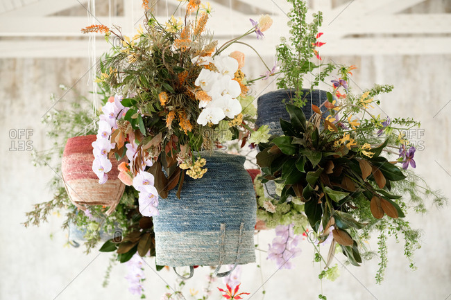 Hanging floral arrangements at an outdoor wedding