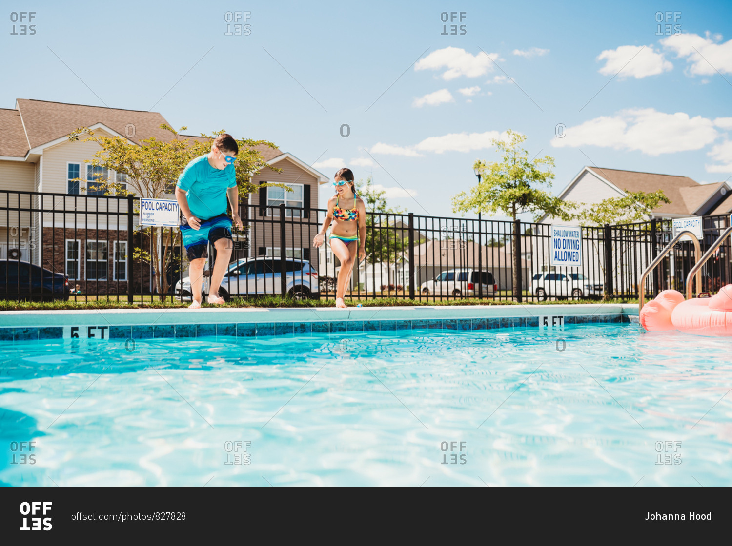Two kids running to jump in a swimming pool