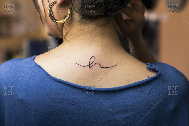 New tattoo on the nape of a woman