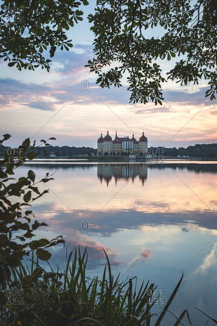Germany- Saxony- Moritzburg Castle at castle pond in the evening