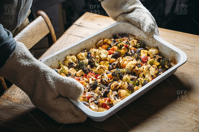 Baked vegetables with feta cheese in a baking pan