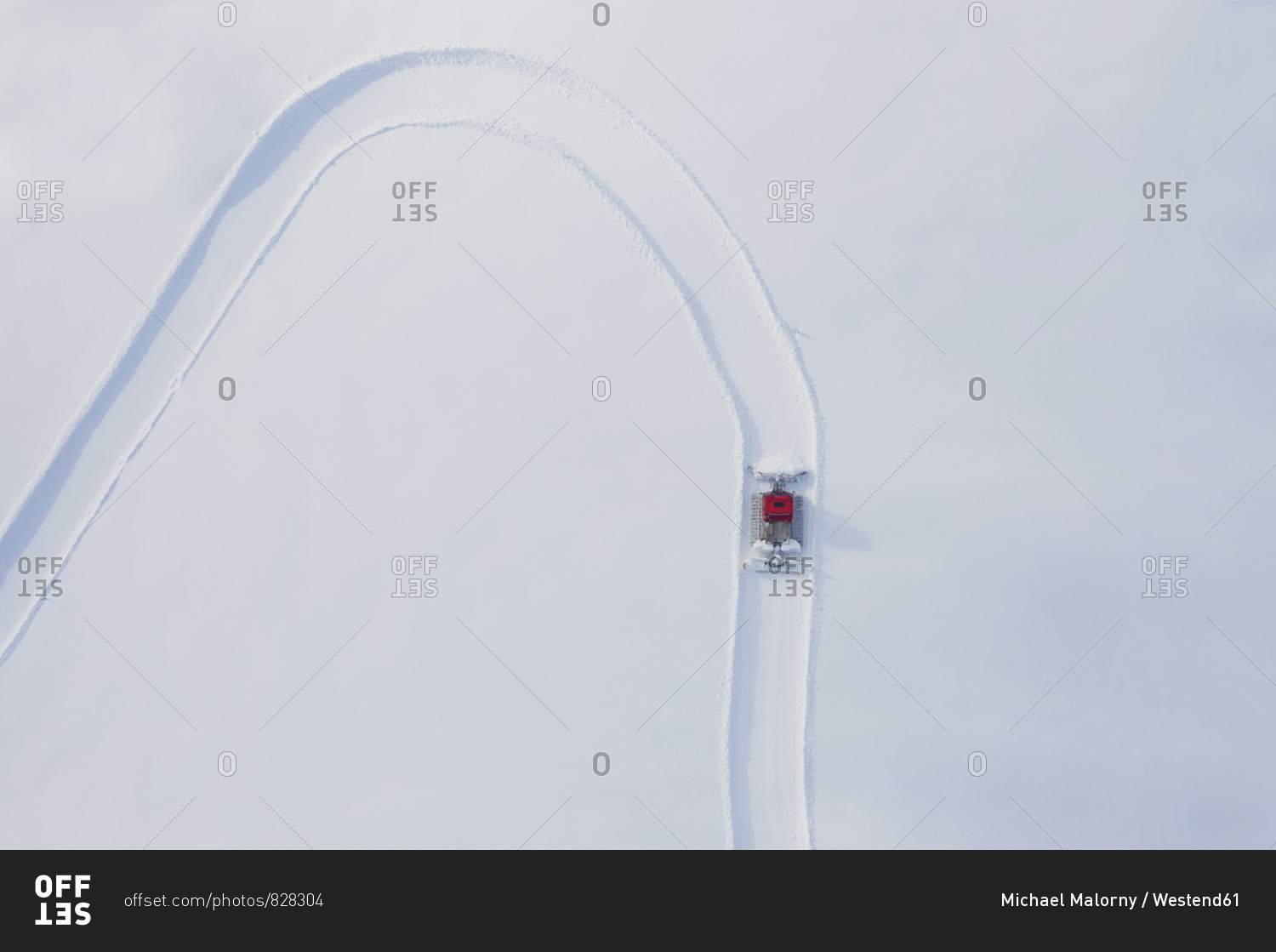 Austria- Tyrol- Galtuer- view to ski slope and snow groomer in winter- aerial view