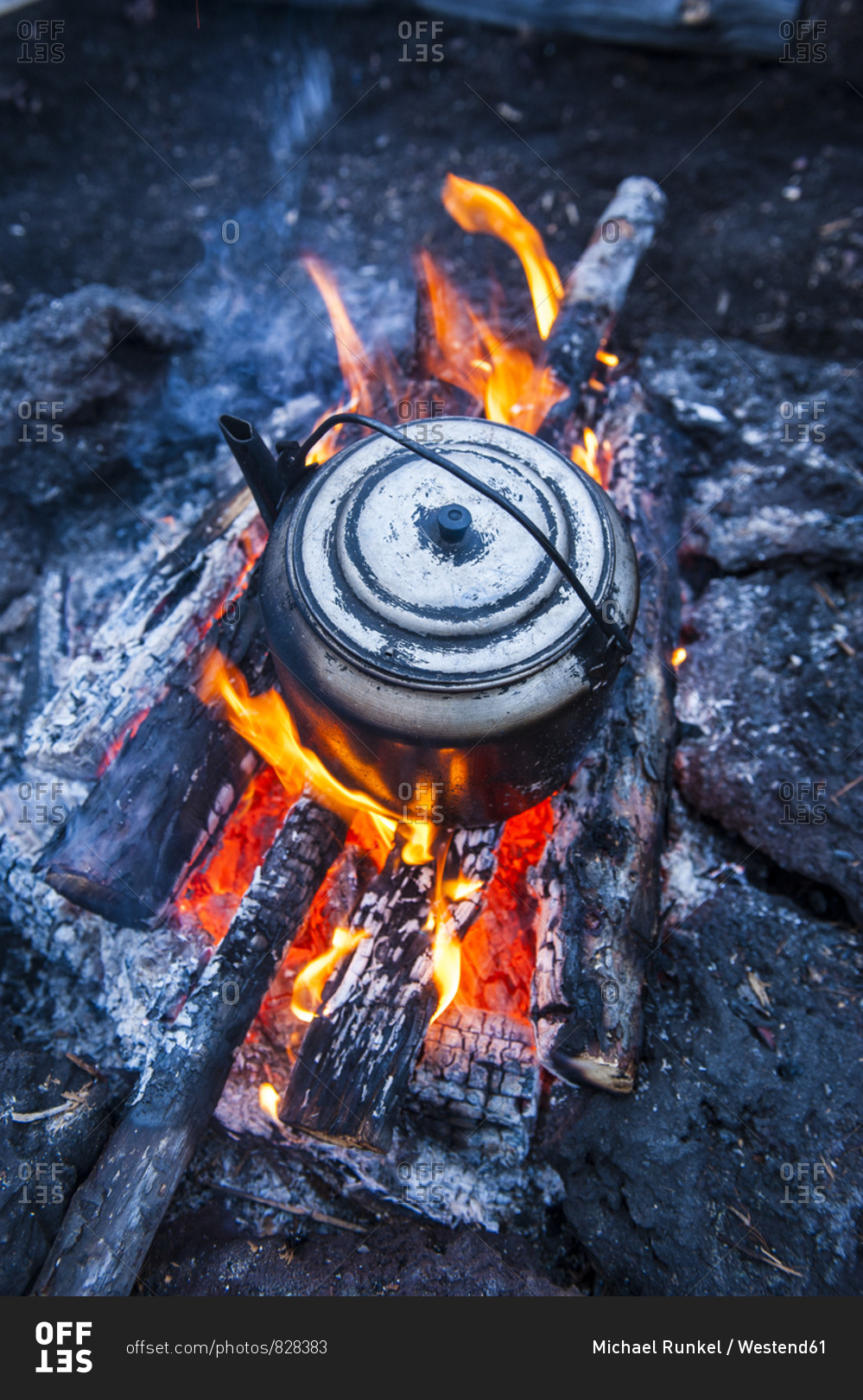 Boiling water pot over an open fire on a campsite on Tolbachik volcano- Kamchatka- Russia
