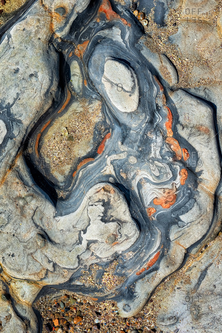 Close-up of tide pool rocks with unique colors and patterns
