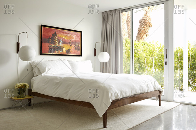 February 26, 2019: Bedroom with bright windows in a modern home