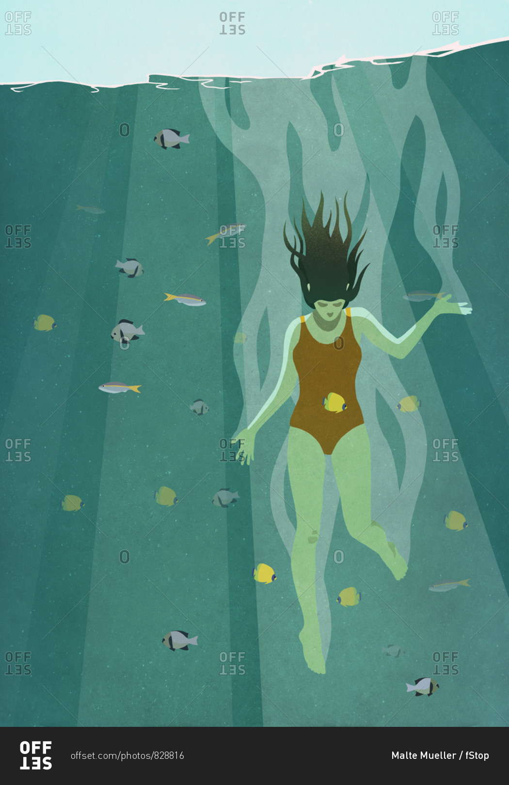 Woman diving into ocean surrounded by fish